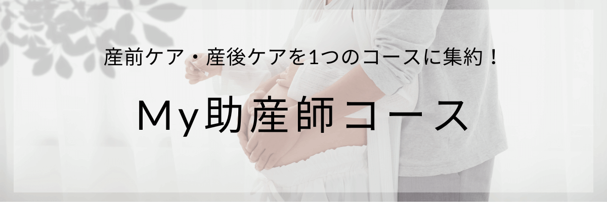 妊婦ママの大きなおなかにやさしく触れるパパ