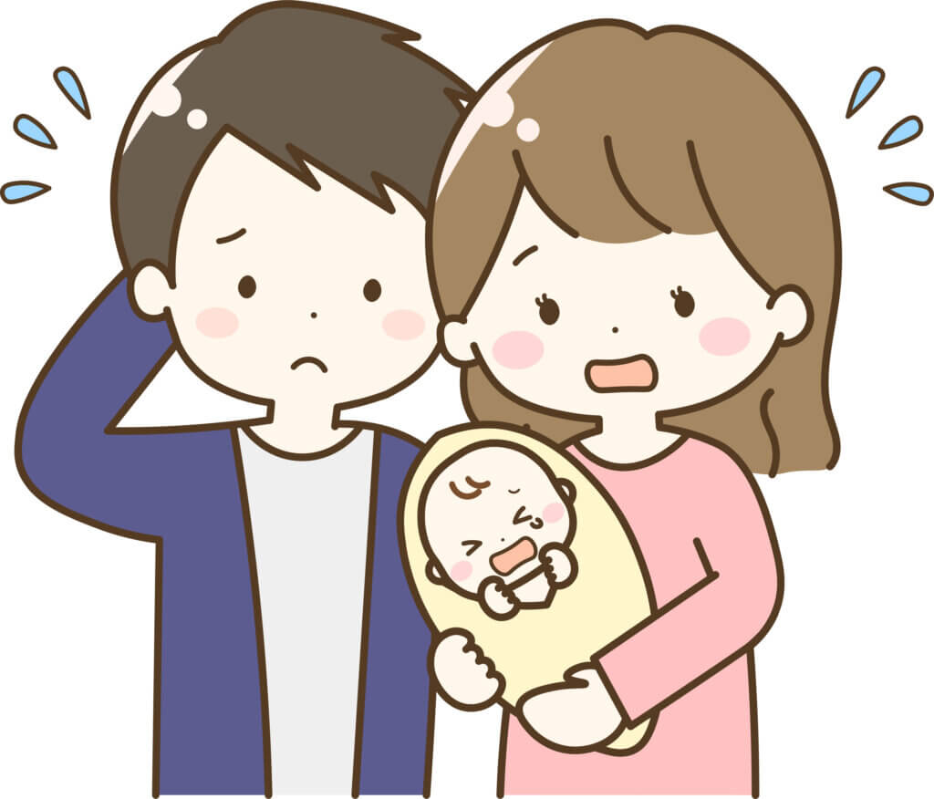 泣いている赤ちゃんを抱く困っている両親