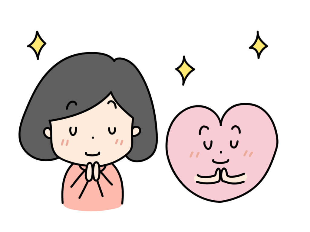 ハートと祈る女性