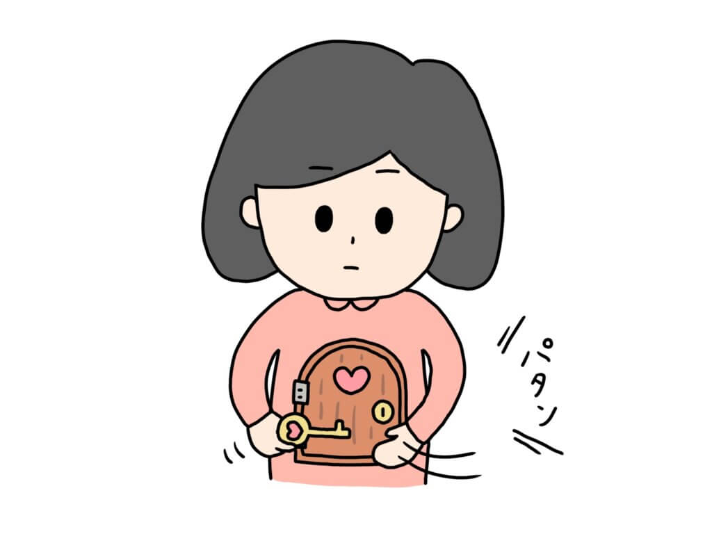 心に鍵をかける女性
